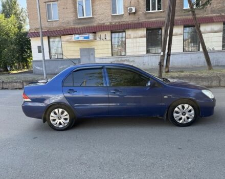 Синій Міцубісі Lancer, об'ємом двигуна 1.3 л та пробігом 198 тис. км за 3750 $, фото 5 на Automoto.ua
