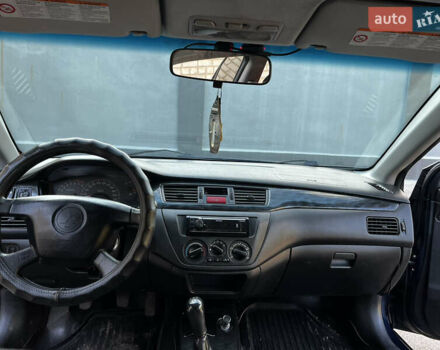 Синій Міцубісі Lancer, об'ємом двигуна 1.58 л та пробігом 324 тис. км за 4150 $, фото 12 на Automoto.ua