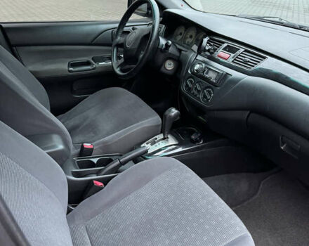 Синій Міцубісі Lancer, об'ємом двигуна 1.6 л та пробігом 200 тис. км за 5000 $, фото 6 на Automoto.ua