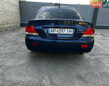 Синій Міцубісі Lancer, об'ємом двигуна 1.58 л та пробігом 324 тис. км за 4150 $, фото 4 на Automoto.ua