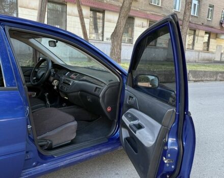 Синій Міцубісі Lancer, об'ємом двигуна 1.3 л та пробігом 198 тис. км за 3750 $, фото 11 на Automoto.ua