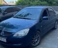 Синій Міцубісі Lancer, об'ємом двигуна 2 л та пробігом 335 тис. км за 4700 $, фото 1 на Automoto.ua