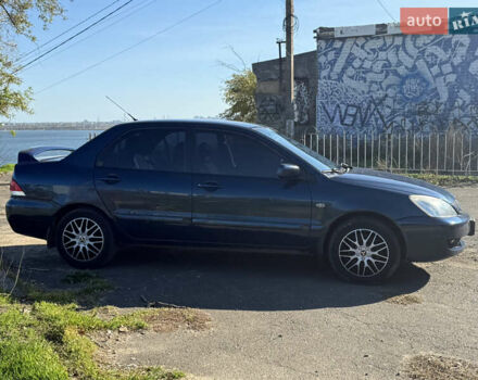 Синій Міцубісі Lancer, об'ємом двигуна 1.58 л та пробігом 269 тис. км за 3350 $, фото 3 на Automoto.ua