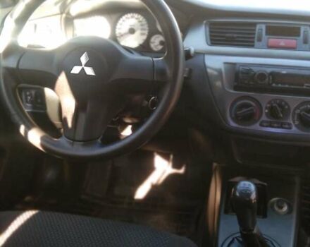 Синий Мицубиси Лансер, объемом двигателя 1.58 л и пробегом 195 тыс. км за 3990 $, фото 20 на Automoto.ua