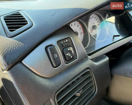 Синій Міцубісі Lancer, об'ємом двигуна 1.58 л та пробігом 269 тис. км за 3350 $, фото 14 на Automoto.ua