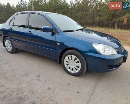 Синий Мицубиси Лансер, объемом двигателя 1.6 л и пробегом 222 тыс. км за 4599 $, фото 3 на Automoto.ua