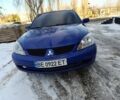 Синий Мицубиси Лансер, объемом двигателя 1.6 л и пробегом 300 тыс. км за 3000 $, фото 1 на Automoto.ua