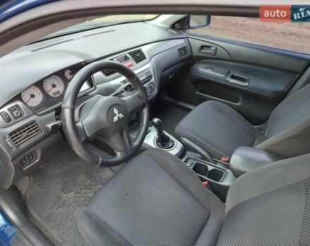 Синий Мицубиси Лансер, объемом двигателя 1.6 л и пробегом 222 тыс. км за 4599 $, фото 10 на Automoto.ua