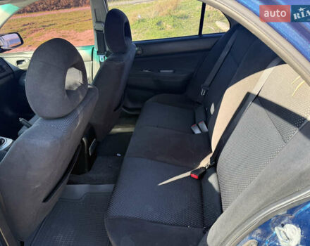 Синій Міцубісі Lancer, об'ємом двигуна 1.58 л та пробігом 269 тис. км за 3350 $, фото 16 на Automoto.ua