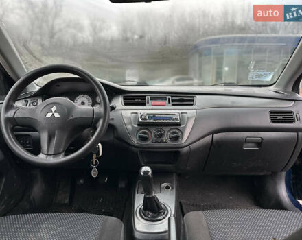 Синий Мицубиси Лансер, объемом двигателя 1.58 л и пробегом 260 тыс. км за 2300 $, фото 4 на Automoto.ua