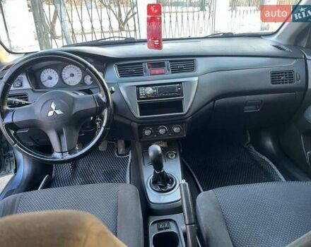 Синій Міцубісі Lancer, об'ємом двигуна 1.6 л та пробігом 172 тис. км за 5900 $, фото 12 на Automoto.ua