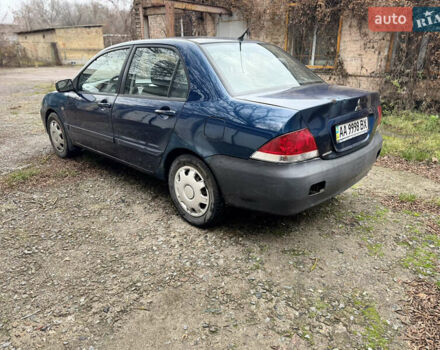 Синий Мицубиси Лансер, объемом двигателя 1.58 л и пробегом 243 тыс. км за 2900 $, фото 7 на Automoto.ua