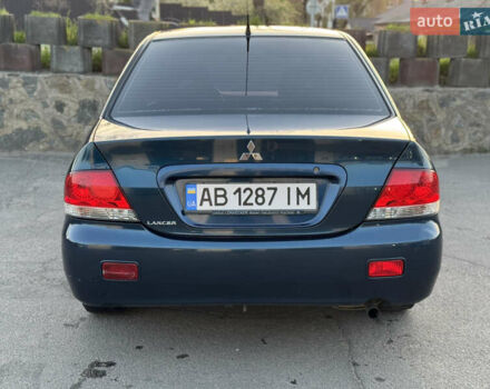 Синий Мицубиси Лансер, объемом двигателя 1.58 л и пробегом 300 тыс. км за 3650 $, фото 8 на Automoto.ua
