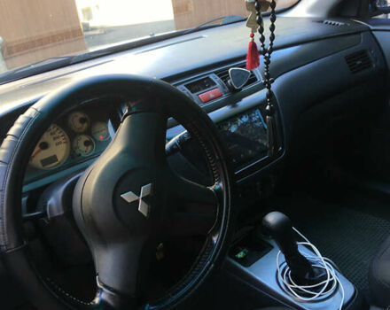 Синий Мицубиси Лансер, объемом двигателя 1.6 л и пробегом 169 тыс. км за 5100 $, фото 3 на Automoto.ua