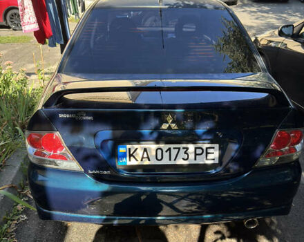 Синий Мицубиси Лансер, объемом двигателя 2 л и пробегом 307 тыс. км за 4300 $, фото 1 на Automoto.ua