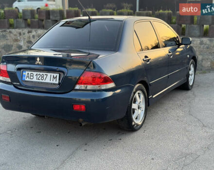 Синий Мицубиси Лансер, объемом двигателя 1.58 л и пробегом 300 тыс. км за 3650 $, фото 12 на Automoto.ua