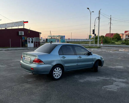 Синій Міцубісі Lancer, об'ємом двигуна 1.6 л та пробігом 237 тис. км за 4099 $, фото 3 на Automoto.ua