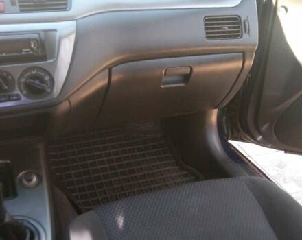 Синий Мицубиси Лансер, объемом двигателя 1.58 л и пробегом 195 тыс. км за 3990 $, фото 19 на Automoto.ua