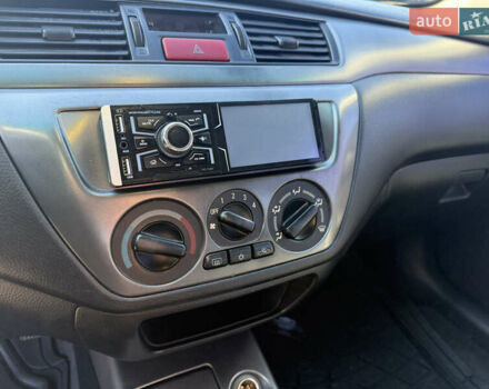 Синій Міцубісі Lancer, об'ємом двигуна 1.58 л та пробігом 269 тис. км за 3350 $, фото 12 на Automoto.ua