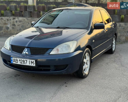 Синий Мицубиси Лансер, объемом двигателя 1.58 л и пробегом 300 тыс. км за 3650 $, фото 5 на Automoto.ua
