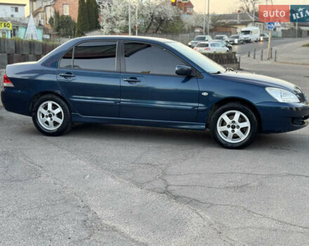 Синий Мицубиси Лансер, объемом двигателя 1.58 л и пробегом 300 тыс. км за 3650 $, фото 4 на Automoto.ua