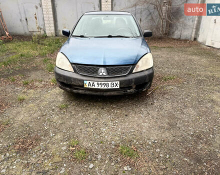 Синий Мицубиси Лансер, объемом двигателя 1.58 л и пробегом 243 тыс. км за 2900 $, фото 2 на Automoto.ua