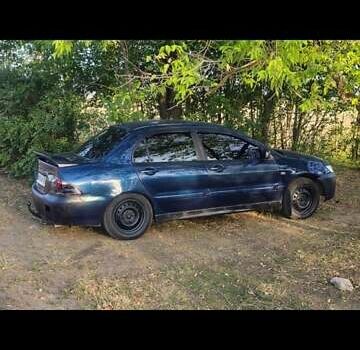 Синий Мицубиси Лансер, объемом двигателя 1.6 л и пробегом 360 тыс. км за 3000 $, фото 1 на Automoto.ua