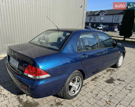 Синій Міцубісі Lancer, об'ємом двигуна 1.6 л та пробігом 148 тис. км за 3000 $, фото 3 на Automoto.ua