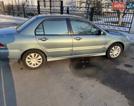 Синій Міцубісі Lancer, об'ємом двигуна 1.6 л та пробігом 172 тис. км за 5900 $, фото 1 на Automoto.ua