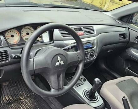 Синий Мицубиси Лансер, объемом двигателя 1.62 л и пробегом 114 тыс. км за 5200 $, фото 8 на Automoto.ua