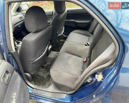 Синий Мицубиси Лансер, объемом двигателя 1.58 л и пробегом 243 тыс. км за 2900 $, фото 10 на Automoto.ua