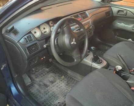 Синий Мицубиси Лансер, объемом двигателя 1.6 л и пробегом 360 тыс. км за 3000 $, фото 6 на Automoto.ua