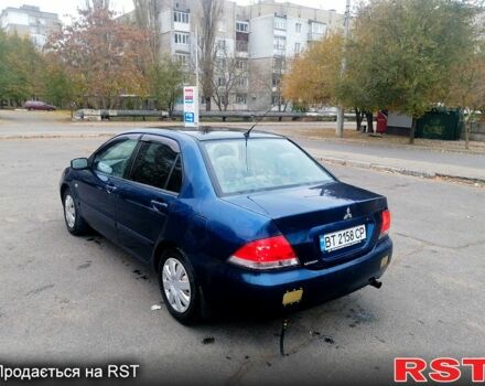 Синий Мицубиси Лансер, объемом двигателя 1.6 л и пробегом 258 тыс. км за 3400 $, фото 1 на Automoto.ua