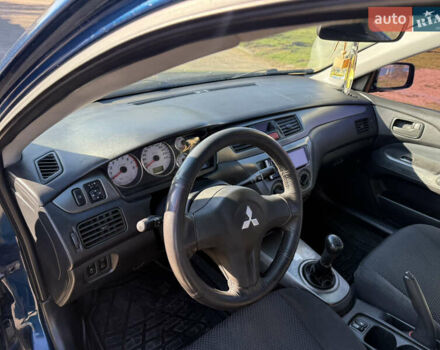 Синій Міцубісі Lancer, об'ємом двигуна 1.58 л та пробігом 269 тис. км за 3350 $, фото 7 на Automoto.ua
