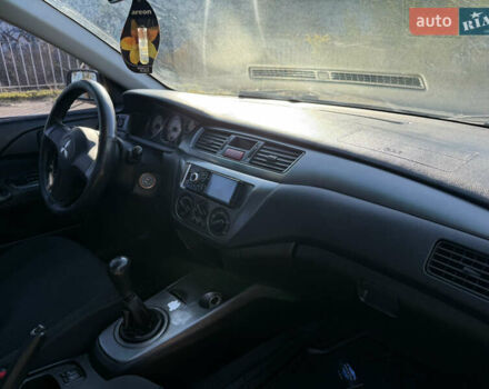 Синій Міцубісі Lancer, об'ємом двигуна 1.58 л та пробігом 269 тис. км за 3350 $, фото 23 на Automoto.ua