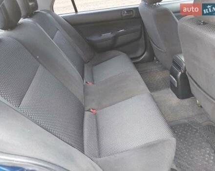 Синий Мицубиси Лансер, объемом двигателя 1.6 л и пробегом 222 тыс. км за 4599 $, фото 13 на Automoto.ua