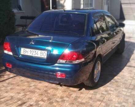 Синий Мицубиси Лансер, объемом двигателя 1.58 л и пробегом 195 тыс. км за 3990 $, фото 3 на Automoto.ua
