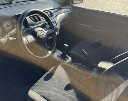 Синій Міцубісі Lancer, об'ємом двигуна 1.6 л та пробігом 148 тис. км за 3000 $, фото 13 на Automoto.ua
