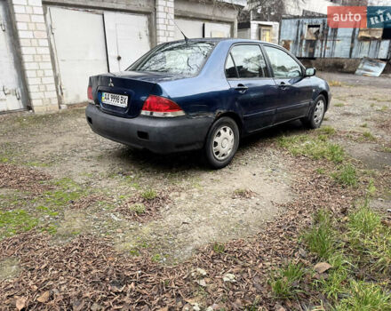 Синий Мицубиси Лансер, объемом двигателя 1.58 л и пробегом 243 тыс. км за 2900 $, фото 5 на Automoto.ua