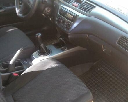 Синий Мицубиси Лансер, объемом двигателя 1.58 л и пробегом 195 тыс. км за 3990 $, фото 6 на Automoto.ua