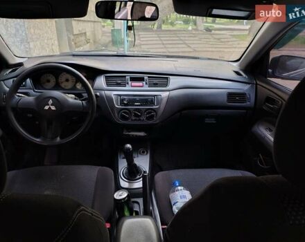 Синий Мицубиси Лансер, объемом двигателя 1.6 л и пробегом 360 тыс. км за 3000 $, фото 5 на Automoto.ua