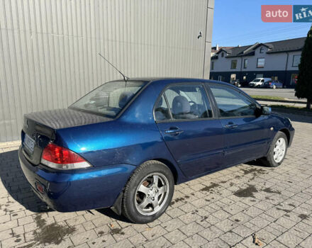 Синій Міцубісі Lancer, об'ємом двигуна 1.6 л та пробігом 148 тис. км за 3000 $, фото 6 на Automoto.ua