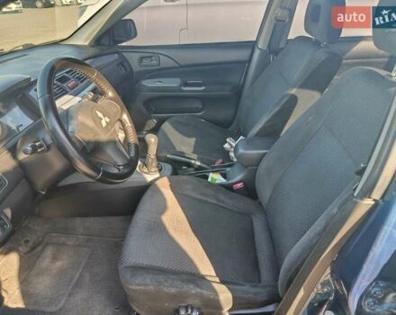 Синий Мицубиси Лансер, объемом двигателя 1.58 л и пробегом 274 тыс. км за 2650 $, фото 5 на Automoto.ua