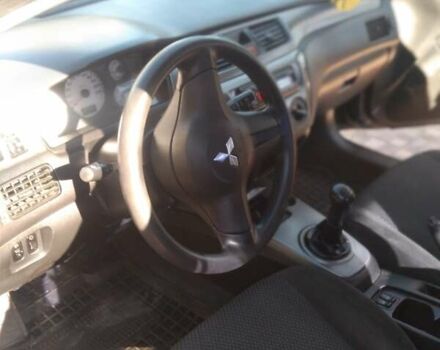 Синий Мицубиси Лансер, объемом двигателя 1.58 л и пробегом 195 тыс. км за 3990 $, фото 22 на Automoto.ua