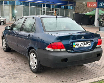 Синий Мицубиси Лансер, объемом двигателя 1.58 л и пробегом 260 тыс. км за 2300 $, фото 2 на Automoto.ua