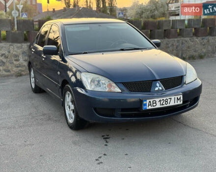 Синий Мицубиси Лансер, объемом двигателя 1.58 л и пробегом 300 тыс. км за 3650 $, фото 1 на Automoto.ua