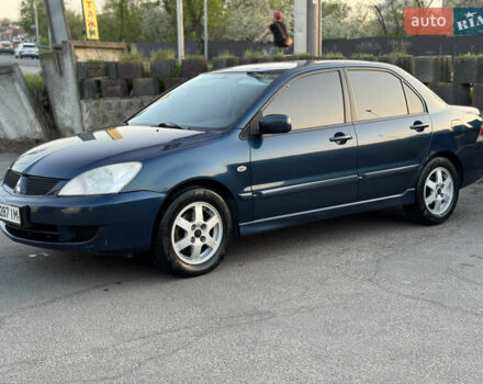 Синий Мицубиси Лансер, объемом двигателя 1.58 л и пробегом 300 тыс. км за 3650 $, фото 7 на Automoto.ua