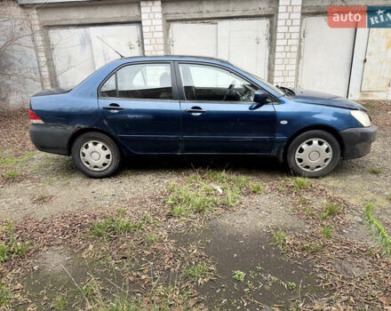 Синий Мицубиси Лансер, объемом двигателя 1.58 л и пробегом 243 тыс. км за 2900 $, фото 4 на Automoto.ua