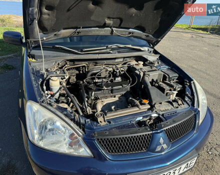 Синій Міцубісі Lancer, об'ємом двигуна 1.58 л та пробігом 269 тис. км за 3350 $, фото 24 на Automoto.ua
