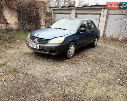 Синий Мицубиси Лансер, объемом двигателя 1.58 л и пробегом 243 тыс. км за 2900 $, фото 1 на Automoto.ua